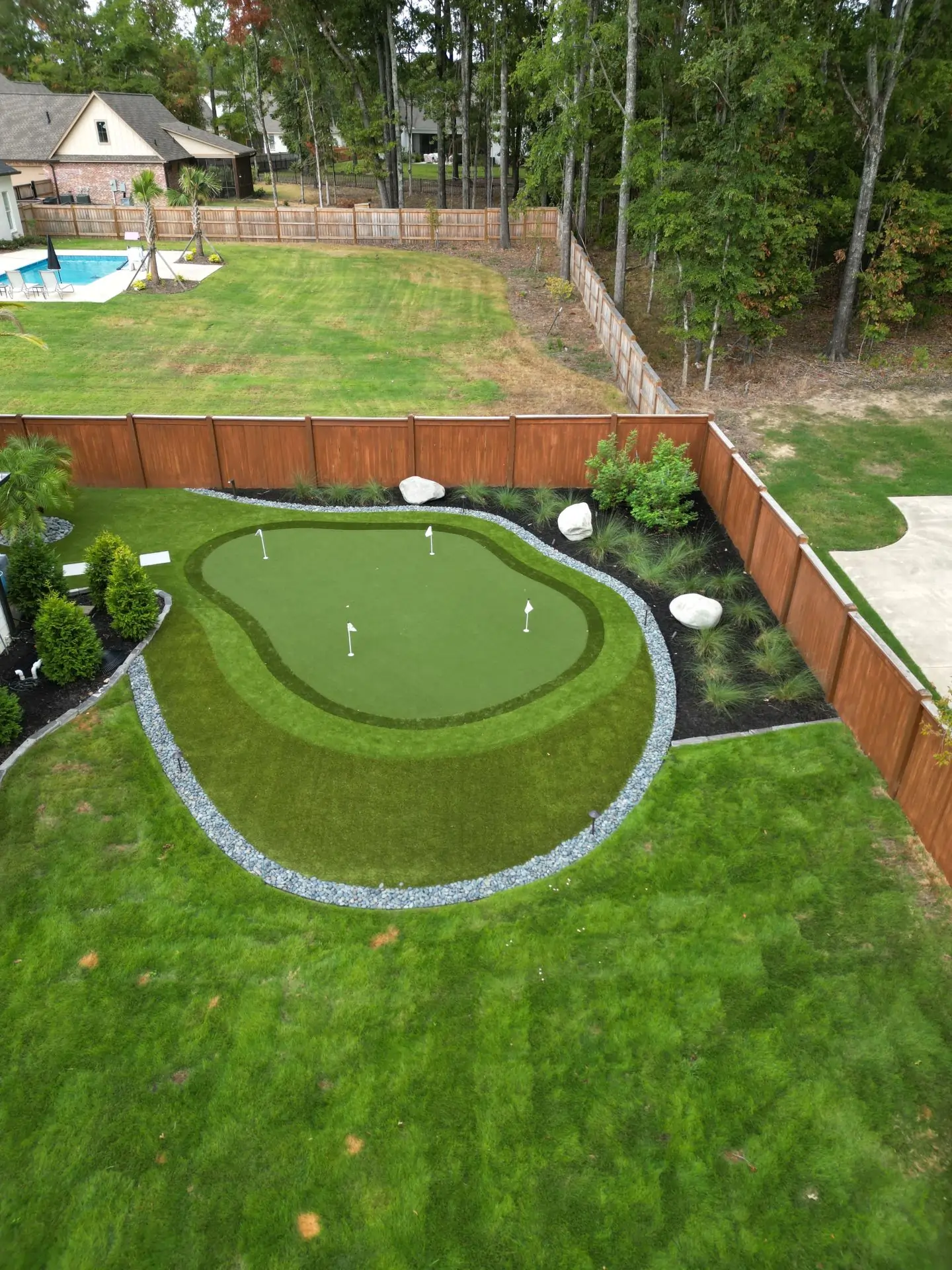 synthetic grass putting green lawn in back yard
